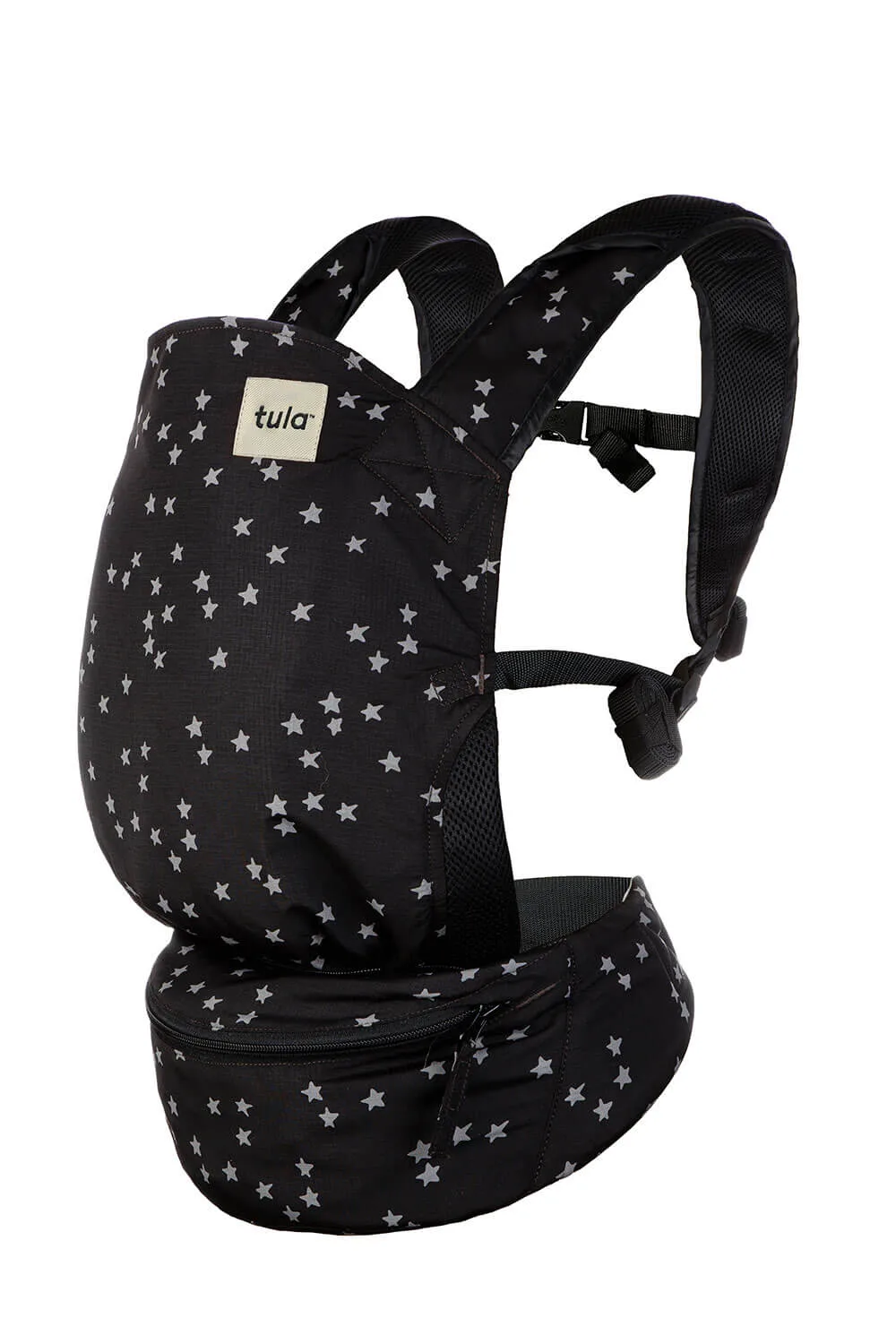 Tula Baby Carrier Review: My Honest Experience and Favorites 4 Tula Lite Compact Baby Carrier in black with a scattered white star pattern, featuring a lightweight design, padded shoulder straps, and a zippered waistband pouch for easy storage when traveling or on the go.