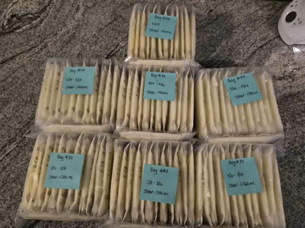 breastmilk-supply-freezer-stash Freshly pumped breast milk in bottles on kitchen counter demonstrating how to increase milk supply with regular pumping sessions.